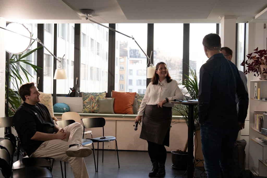 Our Head of Business and Spotlight moderator <strong>Céline Tykve</strong> preparing with confidence and a smile with our speakers and crew before the guests arrive. 