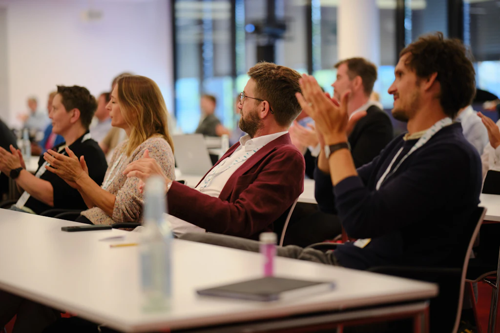 A pleased and inspired audience following two days of presentations.