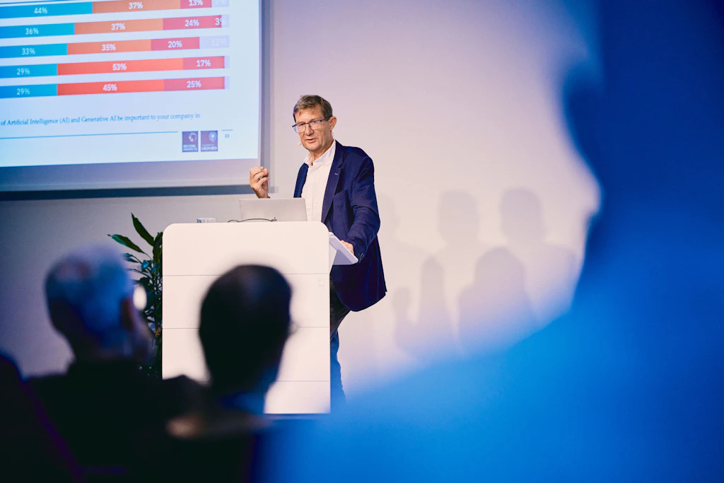 Nic Newman presenting research about changing news consumption at Livingdocs Summit 2026. 